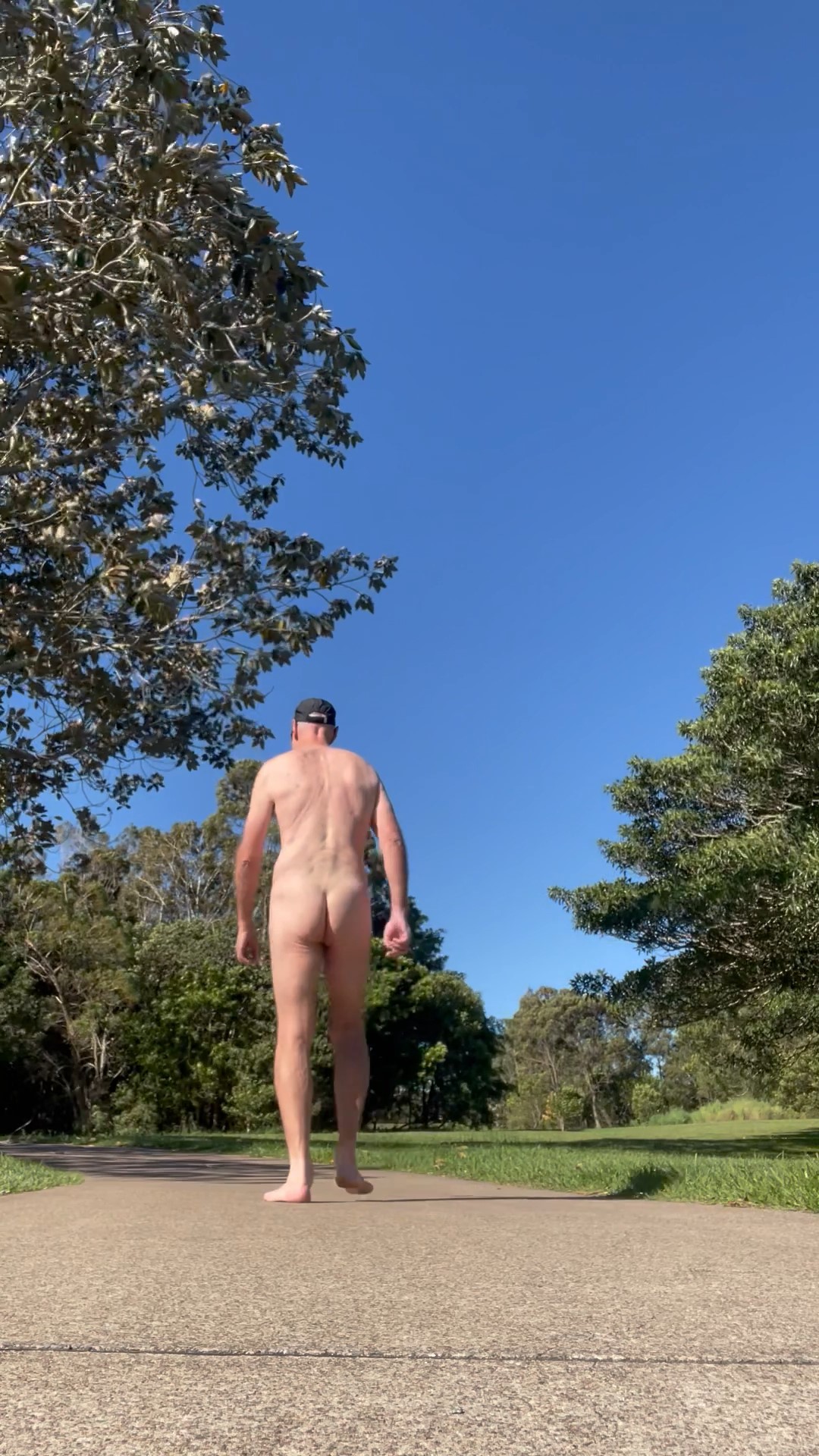 punyc*nt walks nude in a public park in the middle of the day