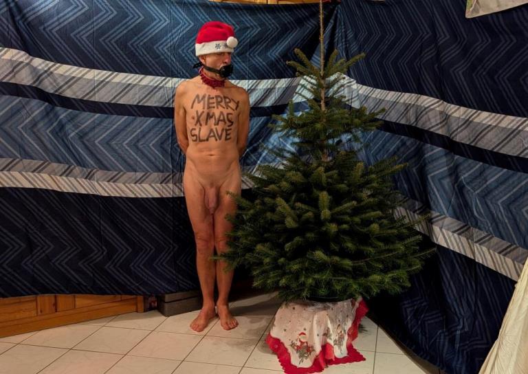 naked pathetic christmas slave decorate the tree