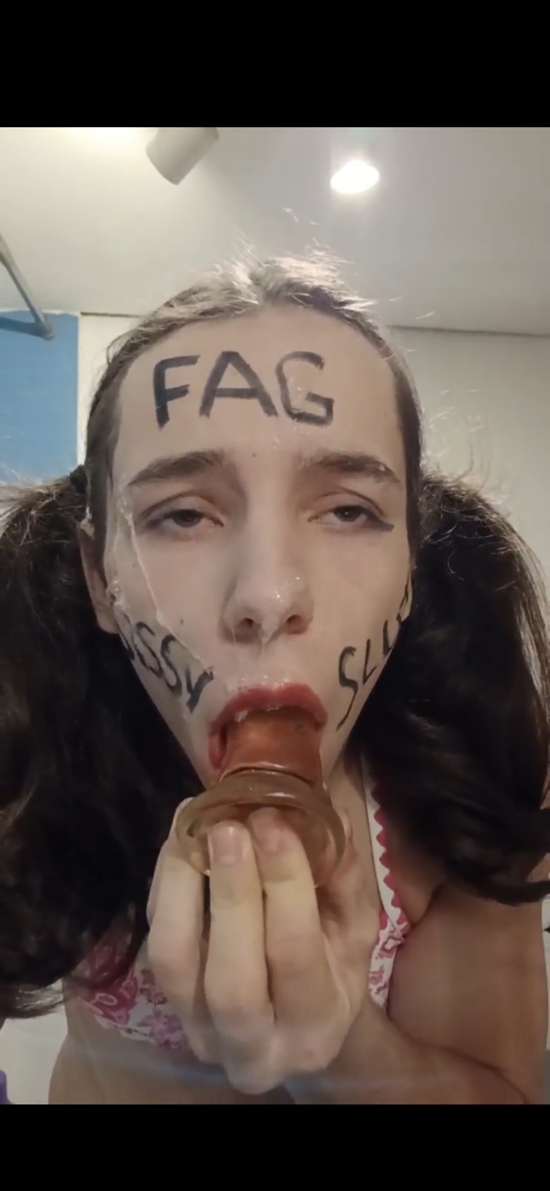 Sissy f*ggot pissing on his face