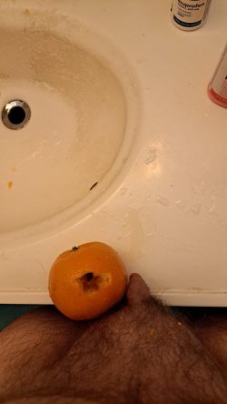 Fucking an orange